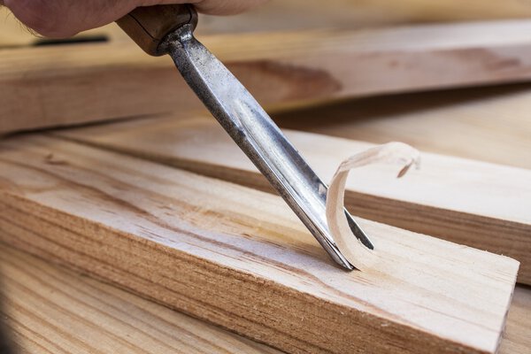 Gouge wood chisel carpenter tool working wooden background