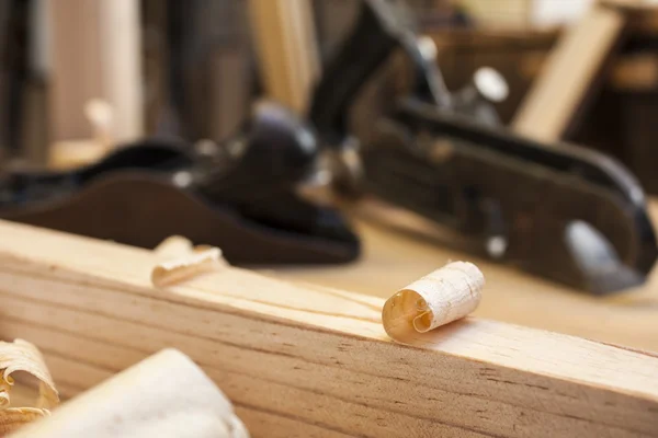 Carpenters planes on wood table construction background — Stock Photo, Image