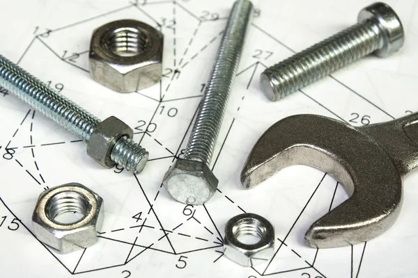 Spanner en noten over technische tekening, mechanisch concept — Stockfoto