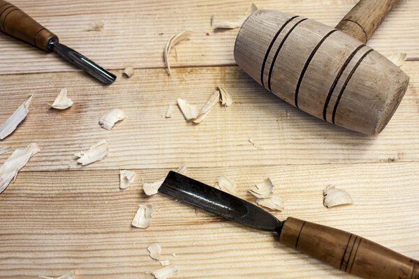 Joiner tools,hammer and chisel on wood table background