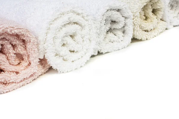 Line of towels different colours isolated on white — Stock Photo, Image