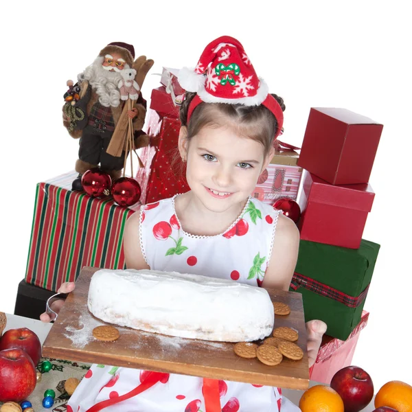 Hübsches kleines Mädchen mit Weihnachtsmann-Helfermütze mit Geschenken auf Weiß — Stockfoto