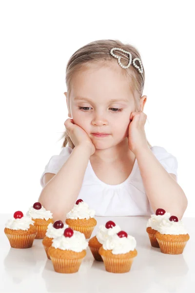 Closeup portrait of sweet little girl with cakes — Stock Photo, Image