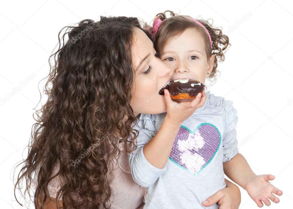 picture of happy mother and little girl with chocolate donut