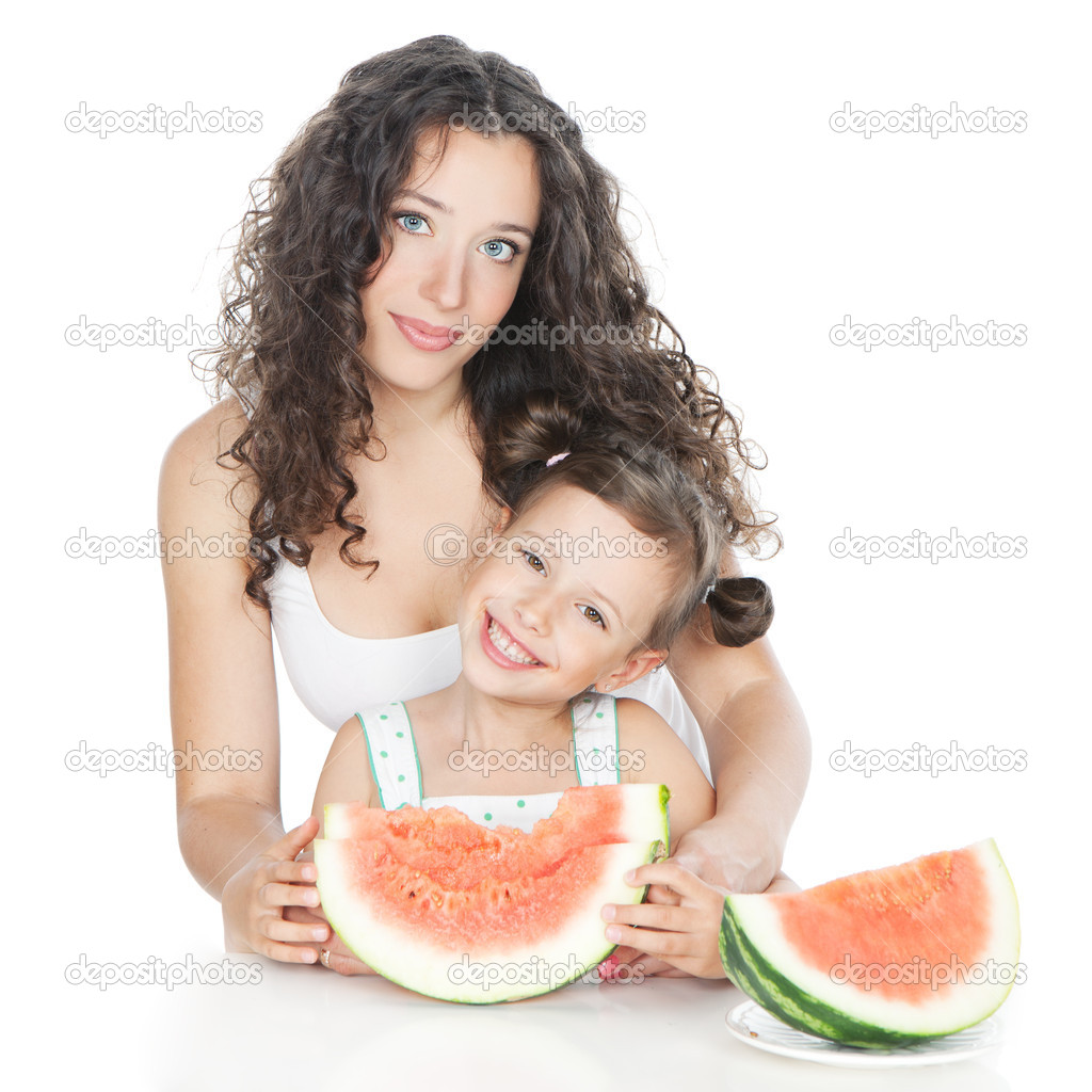 Happy mother and little girl with watermelon