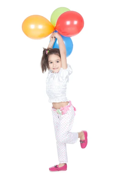 Liten brunett flicka med ballonger i studio — Stockfoto