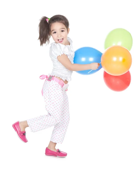 Liten brunett flicka med ballonger i studio — Stockfoto