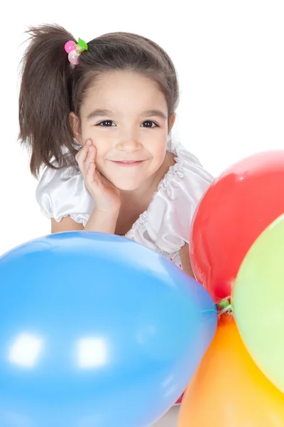 Little brunette girl with balloons in studio — Stock Photo, Image