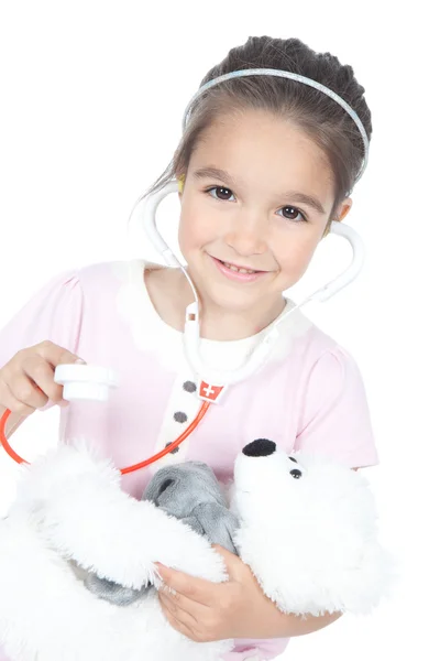 Маленькая девочка-доктор с плюшевым мишкой Стоковое Изображение