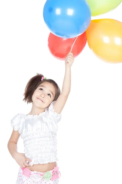 Little brunette girl with balloons in studio Stock Photo