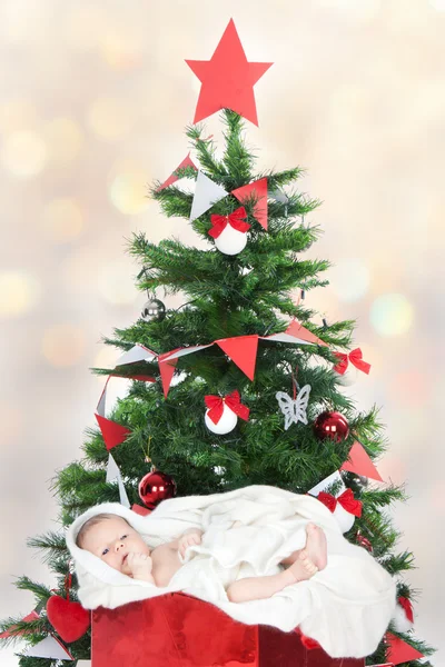 Newborn baby in a present box — Stock Photo, Image