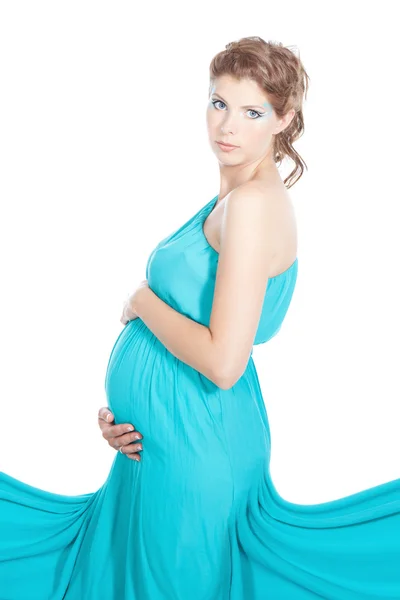 Young beautiful pregnant woman in blue dress Royalty Free Stock Photos