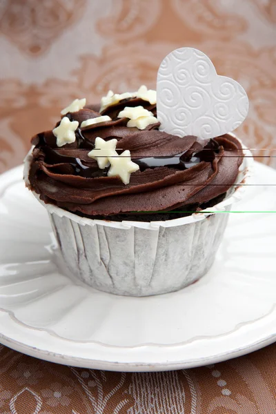 Chocolate cupcake on a table — Stock Photo, Image