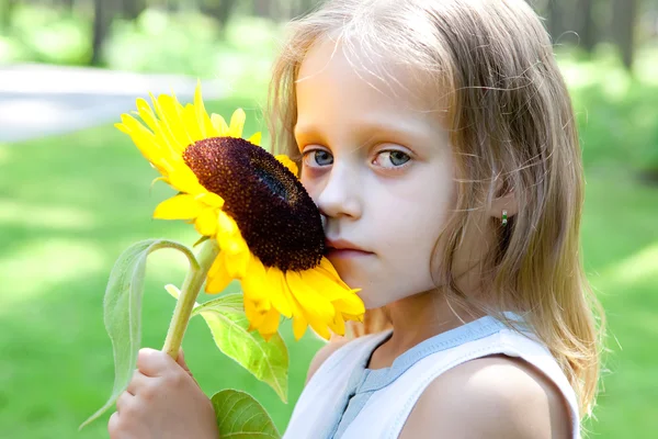 Funny little girl in a park — Stock Photo, Image