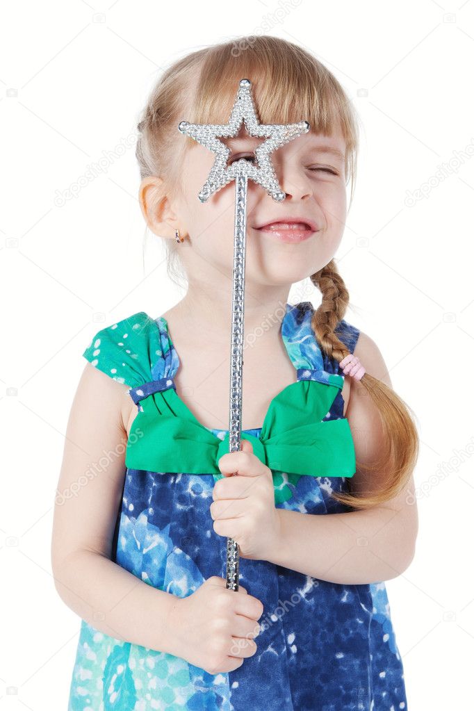 Portrait of a little girl with a magic wand