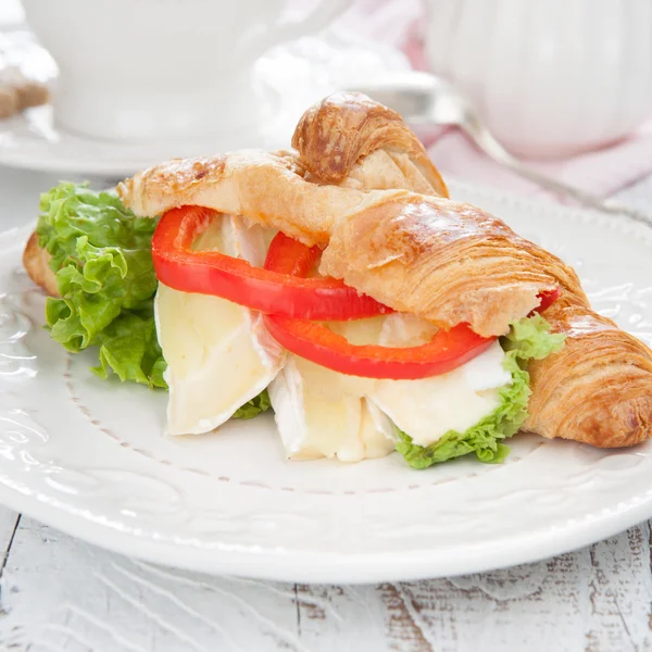 Fresh croissants with cheese on a table — Stock Photo, Image