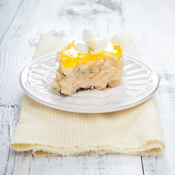 Sweet cake on white wooden table — Stock Photo, Image