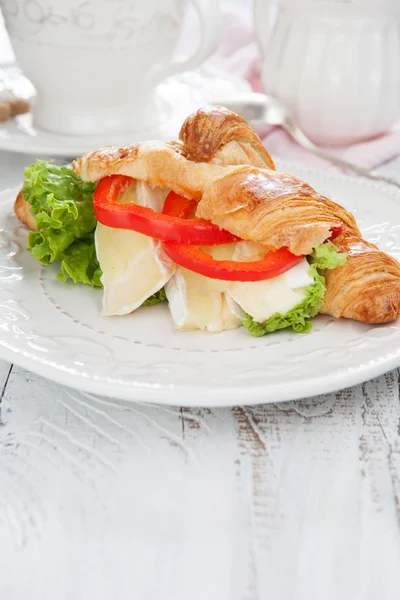 Fresh croissants with cheese on a table — Stock Photo, Image
