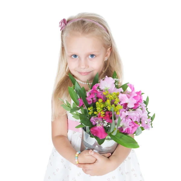 Kleines Mädchen mit bunten Blumen über Weiß — Stockfoto