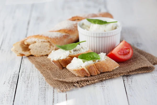 Baguette with cream cheese — Stock Photo, Image