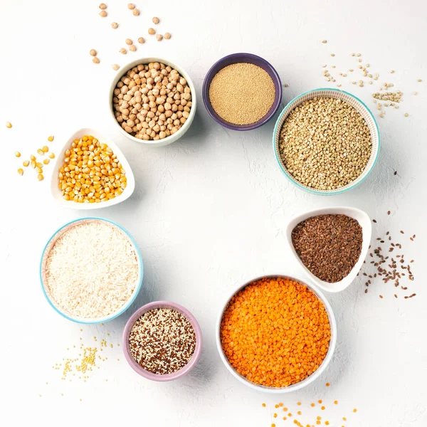 Ancient grain food. Gluten free, Healthy eating, dieting, balanced food concept. Cereals gluten-free, millet, quinoa, polenta, buckwheat, rice, chickpea on white background.