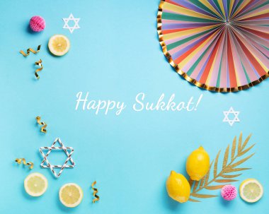 Yahudi ayin festivali Sukkot. Mavi arkaplanda geleneksel bayram sembolleri.