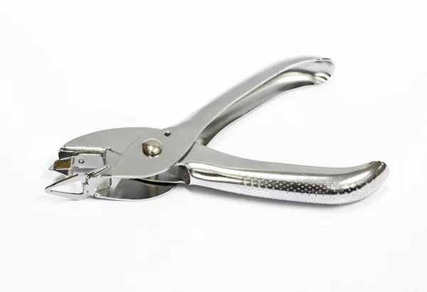 A staple remover on white background Stock Photo
