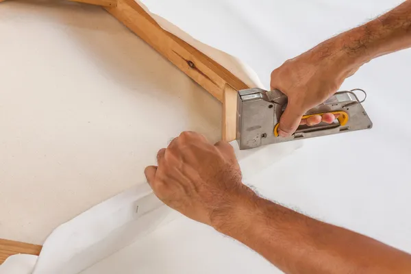 Artist stretching canvas — Stock Photo, Image