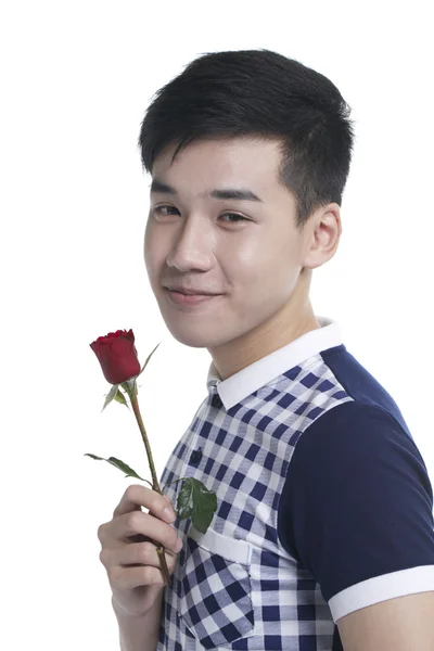 Smiling boy with Valentine red rose, isolated on white — Stock Photo, Image