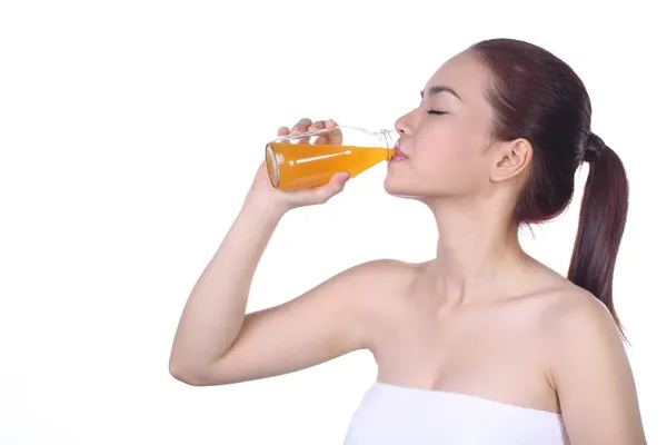 Beautiful Asian woman drink orange juice, isolated on white background — Stock Photo, Image