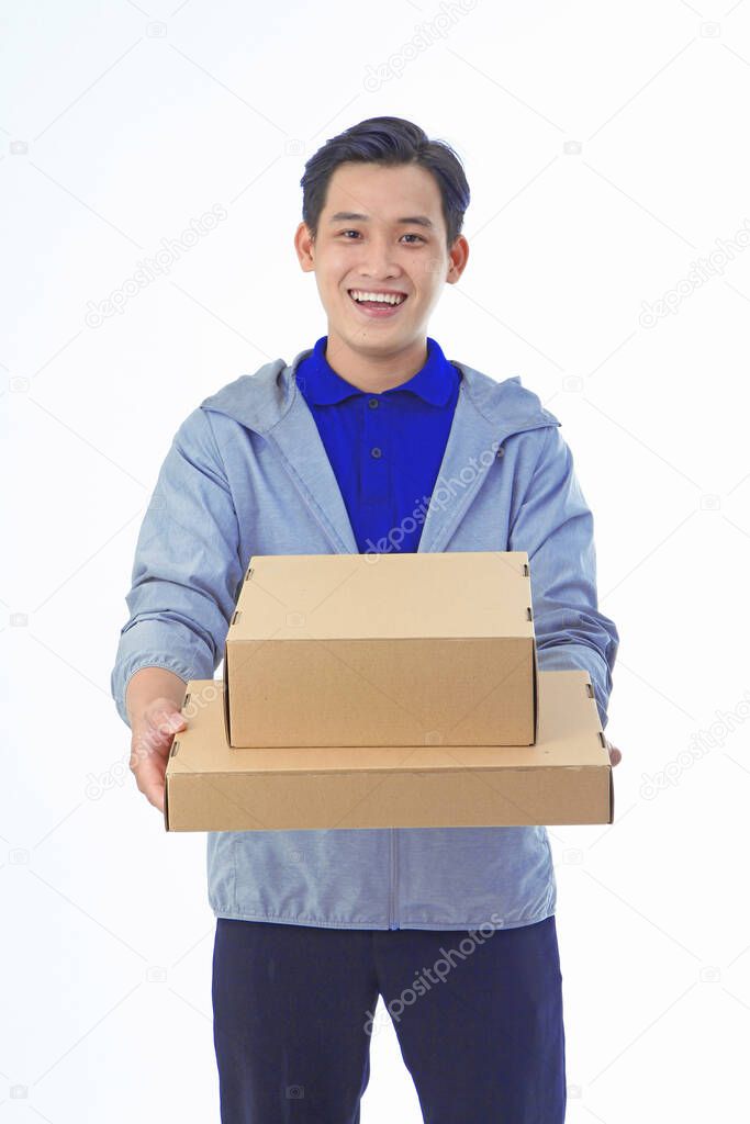 Asian handsome and cheerful young shipping delivery man, isolated on background