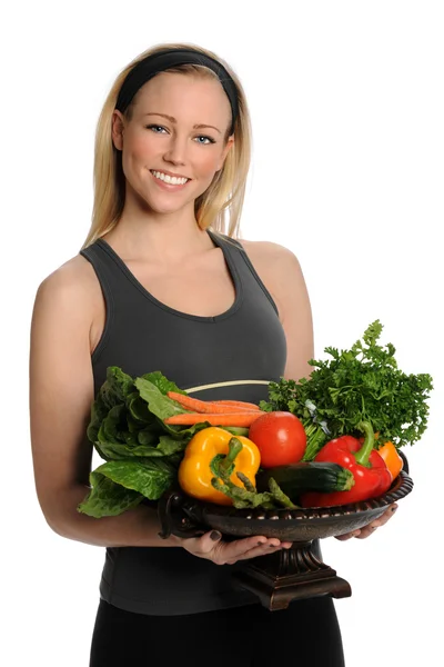 Mujer joven sosteniendo verduras frescas — Foto de Stock