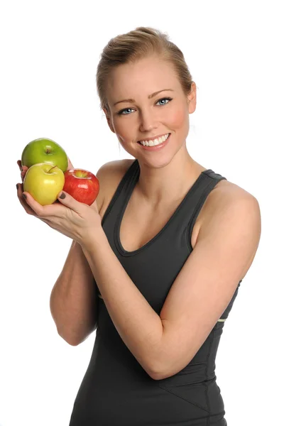 Mujer joven sosteniendo manzanas — Foto de Stock