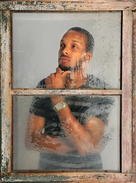 Portrait of Man Looking Through Window — Stock Photo, Image