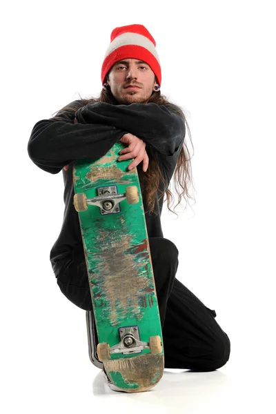 Skateboarder poseren met Raad van bestuur — Stockfoto