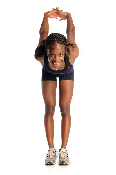 Afroamerikanska kvinna stretching — Stockfoto