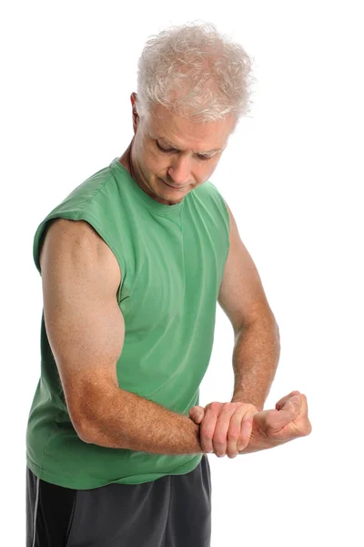 Зрелый человек сгибает руку — стоковое фото
