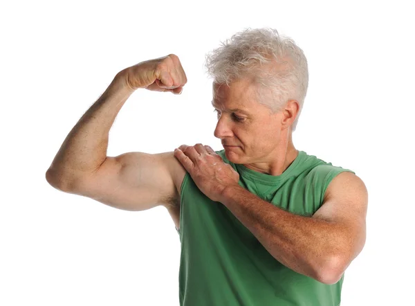 Зріла людина flexing biceps — стокове фото