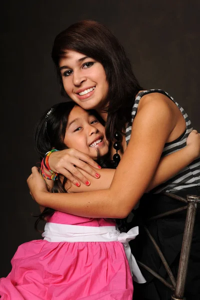 Young Girl and Teenager Embracing — Stock Photo, Image