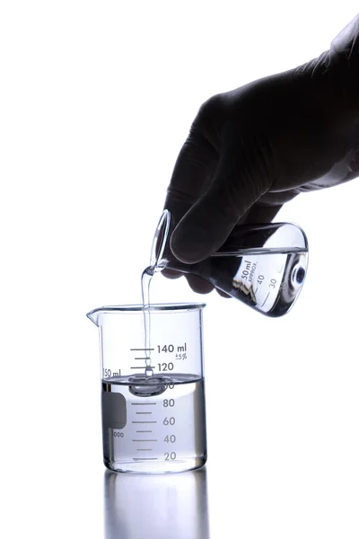 Lab Technician Pouring Liquid into Flask — Stock Photo, Image