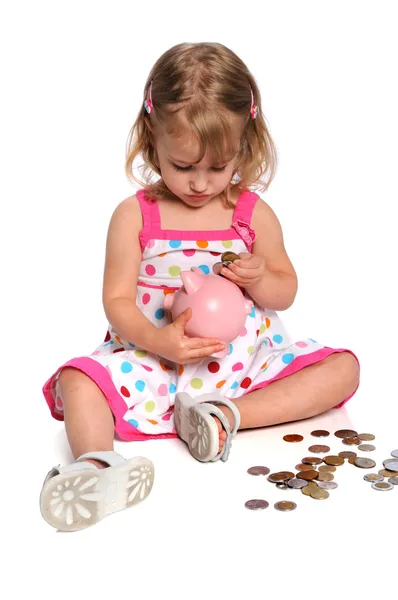 Menina Inserindo Moedas no Piggy Bank — Fotografia de Stock