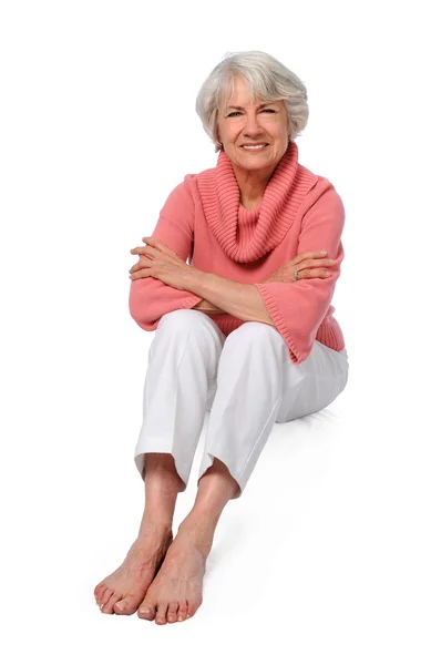 Oudere vrouw zitten — Stockfoto