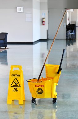 Mop and Bucket with Caution Sign clipart