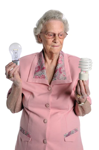 Senior Woman Holding Light Bulbs — Stock Photo, Image