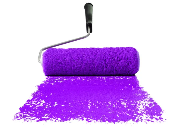 Ролик с фиолетовой краской — стоковое фото