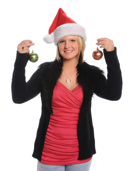 Mujer joven sosteniendo adornos de Navidad — Foto de Stock