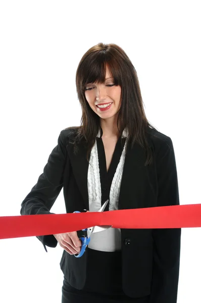Geschäftsfrau schneidet rotes Band durch — Stockfoto