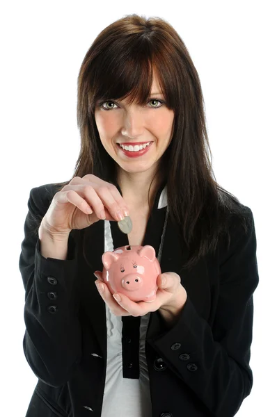 Woman Depositing Coin in Piggy Bank — Stock Photo, Image