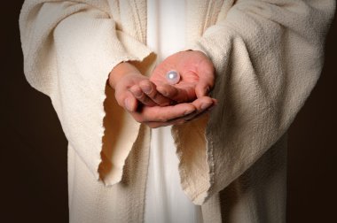 inci holding İsa'nın ellerinde