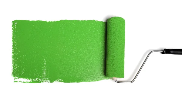Rolo de pintura com tinta verde — Fotografia de Stock
